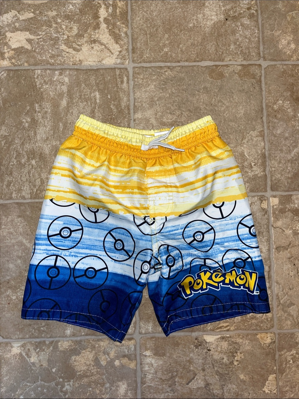 Pokemon Yellow and Blue Kids Swim Shorts with Pokéball Print